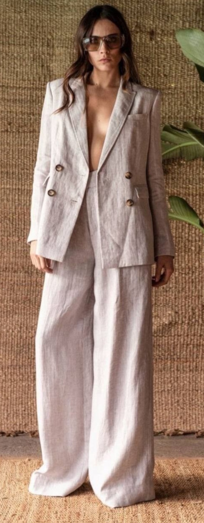 Girl dressed in relaxed linen jacket and matching suit pant